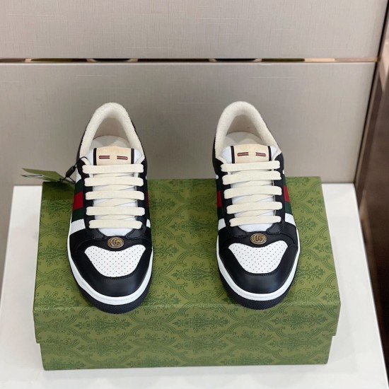 Front view of both Gucci Screener black and white trainers showcasing lace system and oval Double G plaque