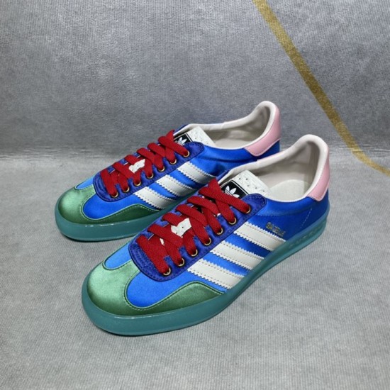 Gucci x Adidas Gazelle Pair Front Angle in blue and white Pair of blue Gucci x Adidas Gazelle satin low-top trainers angled from the front in blue and white