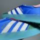 Gucci x Adidas Gazelle Gold Lettering Detail in blue and white Close-up of gold Gazelle lettering on the blue satin upper and white serrated stripes