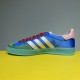 Gucci x Adidas Gazelle Medial Side in blue and white Medial side view of the blue Gucci x Adidas Gazelle trainer with pink heel tab and green toe cap in blue and white