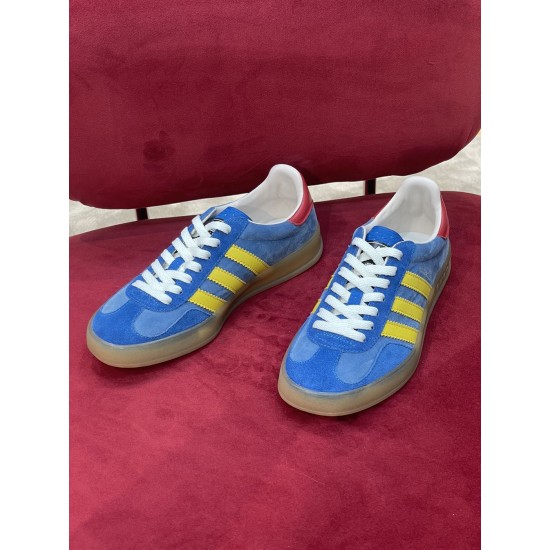Gucci Gazelle Blue Suede Pair Front View in blue and yellow Front-facing view of both blue suede trainers with yellow stripes