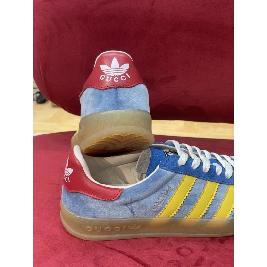 Gucci Gazelle Red Heel Tab Detail in blue and yellow Rear heel view featuring red tab with white logo branding in blue and yellow