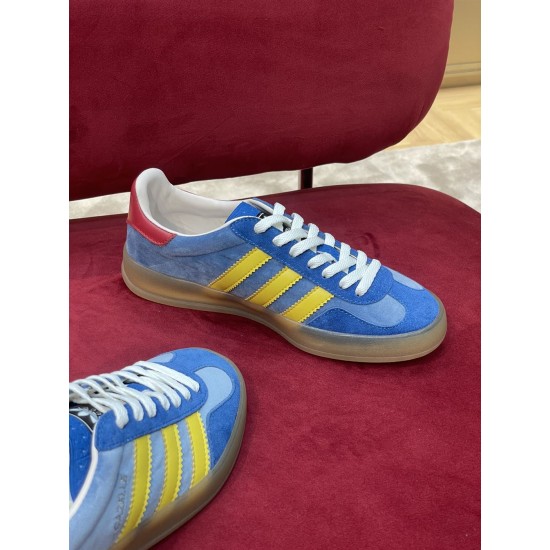 Gucci Gazelle Blue Trainer Top Lateral View in blue and yellow Top-down lateral view of single Gucci Gazelle blue trainer in blue and yellow