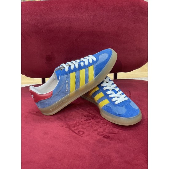 Gucci Gazelle Blue Trainers Angled View in blue and yellow Angled top view showing both Gucci Gazelle blue trainers in blue and yellow