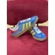 Gucci Gazelle Blue Trainers Angled View in blue and yellow Angled top view showing both Gucci Gazelle blue trainers in blue and yellow