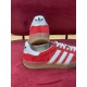Gucci Gazelle Red Velvet Trainer Rear View in red and white Rear heel view showing white heel tabs and branded gum sole on red Gucci Gazelle trainers
