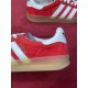 Gucci Gazelle Red Velvet Trainer Heel and Midsole Detail in red and white Close-up of white side stripes, heel tab logo, and embossed gum sole detail on Gucci Gazelle red trainer