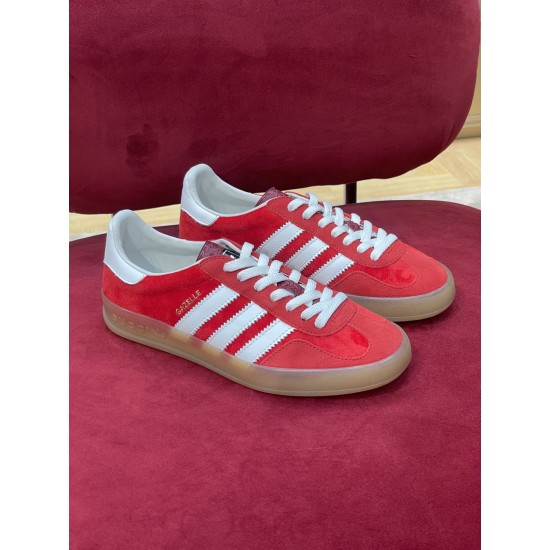 Gucci Gazelle Red Velvet Trainers Pair Front View in red and white Pair of Gucci Gazelle red velvet trainers resting on a red surface in red and white
