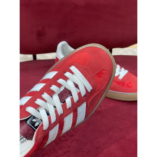 Gucci Gazelle Red Velvet Trainer Laces and Toe Detail in red and white Close-up of toe box, white laces, and patterned tongue on Gucci Gazelle red velvet trainer