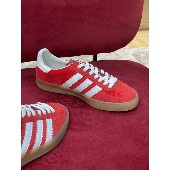 Gucci Gazelle Red Velvet Trainer Side Profile in red and white Side profile of single red velvet Gucci Gazelle trainer with white laces and side stripes
