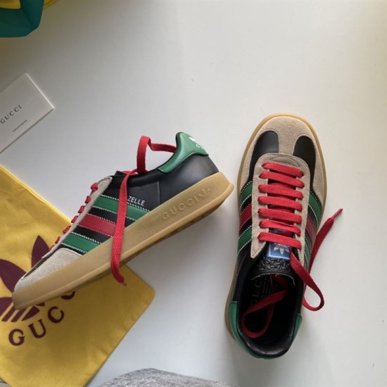 Gucci Gazelle Trainers Angle View in black and red Gucci Gazelle trainer shown from side angle alongside top view of second shoe on white surface in black and red