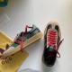 Gucci Gazelle Trainers Angle View in black and red Gucci Gazelle trainer shown from side angle alongside top view of second shoe on white surface in black and red