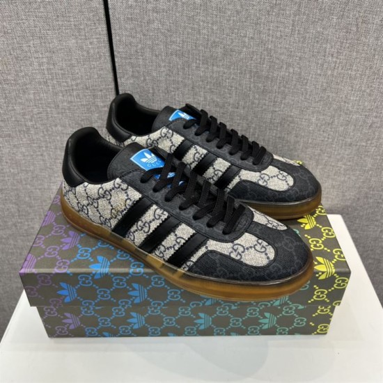 Pair of Gucci Men's Gazelle Monogram Canvas Low-Top Trainers positioned on shoebox top in beige and black
