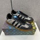 Pair of Gucci Men's Gazelle Monogram Canvas Low-Top Trainers positioned on shoebox top in beige and black