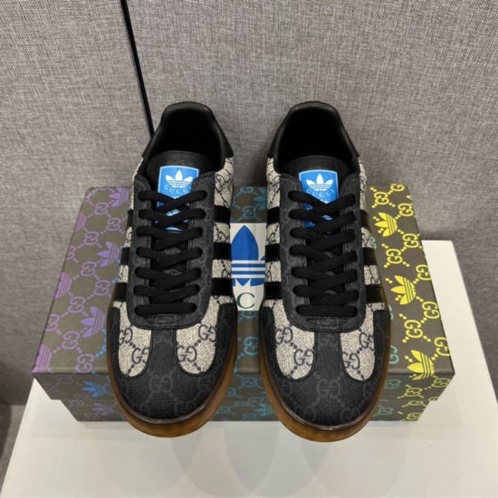 Top-down front view showing laces and blue tongue logo on beige and black trainers