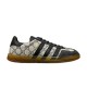 Side profile view of Gucci Men's Gazelle Monogram Canvas Low-Top Trainers in beige and black
