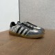 Angled perspective of beige and black Gucci Men's Gazelle Monogram Canvas Low-Top Trainers