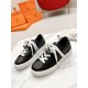 Hermes Day Black Leather Trainers Front Angle in black and white Angled perspective of Hermes Day black leather trainers with white laces