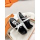 Hermes Day Black Leather Trainers in Packaging in black and white Pair of Hermes Day black leather trainers resting inside an open orange shoe box in black and white