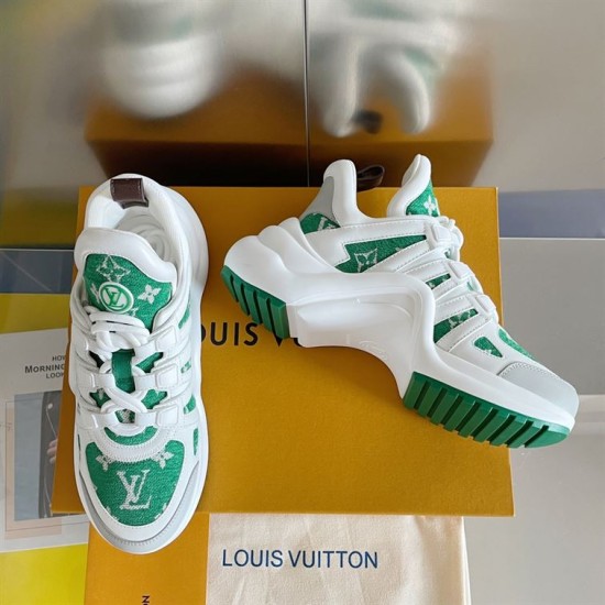 Top Angled View of L Archlight Green and White Shoes Top-down angled perspective of green and white canvas trainers