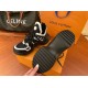 L Archlight Chunky Monogram Arch Sole Trainers Tread Pattern in black and white Underside view of the black treaded rubber outsole on the L Archlight Chunky Trainer in black and white