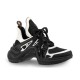 L Archlight Chunky Monogram Arch Sole Trainers Side Profile in black and white Side view of L Archlight Chunky Monogram Arch Sole Black White Trainers displaying the wave-shaped sole.