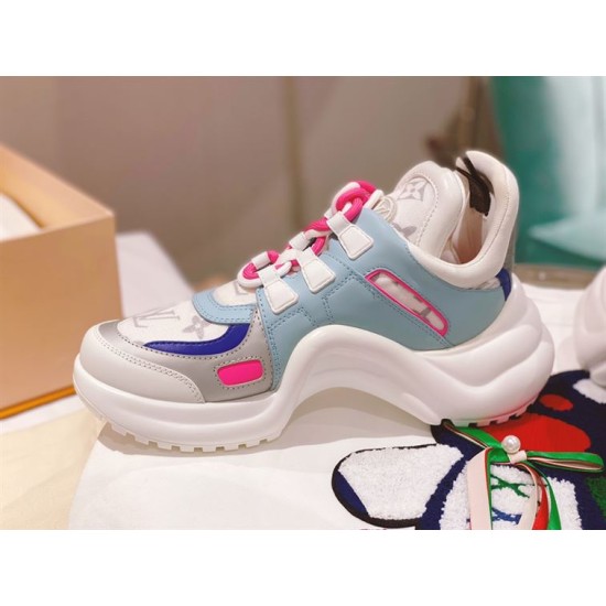 Side display view of L Archlight Chunky Trainers in blue, pink, and white Side view of L Archlight Chunky Trainers in blue, pink, and white on a display