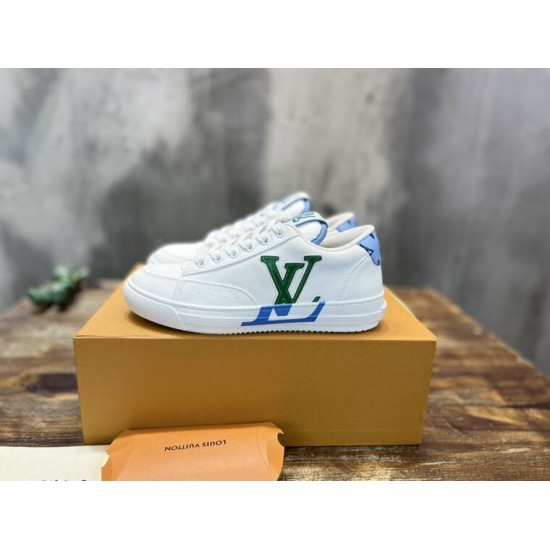 L Charlie Low Top Leather Trainers in white, blue and green displayed on a box L Charlie Low Top Leather Trainers in white, blue and green displayed on a box
