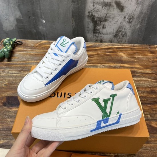 Pair of L Charlie Low Top Leather Trainers in white, blue and green viewed from the side Pair of L Charlie Low Top Leather Trainers in white, blue and green viewed from the side