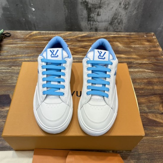 L Charlie Low Top Leather Blue Accent Trainers Front View in blue and white L Charlie Low Top Leather Blue Accent Trainers front view showing lacing and tongue logos in blue and white