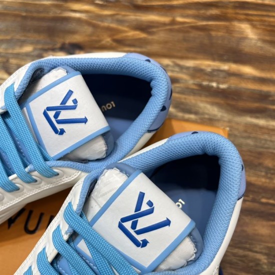 L Charlie Low Top Leather Blue Accent Trainers Interior and Tongue Detail in blue and white L Charlie Low Top Leather Blue Accent Trainers close up of inner lining and branded tongue in blue and white