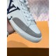 Close-Up of L Charlie Grey Suede Toe Cap and Laces in white Close-up of the grey suede toe cap and lacing system on L Charlie trainer in white