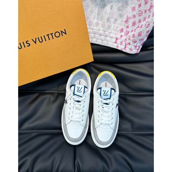 Overhead Angle of L Charlie White and Grey Trainers Overhead angle of L Charlie white and grey trainers on a dark surface