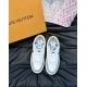 Overhead Angle of L Charlie White and Grey Trainers Overhead angle of L Charlie white and grey trainers on a dark surface