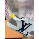 Close-Up of L Charlie Navy Logo and Yellow Heel Tab in white Close-up of the navy side logo and yellow heel tab on L Charlie trainer in white