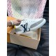 Single L Charlie Trainer Side Profile in white Single L Charlie trainer held up showcasing the side logo and sole in white