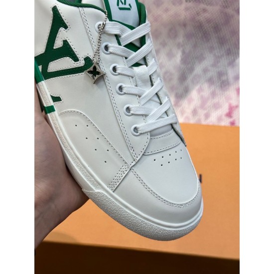 L Charlie Low Top Leather Trainers In White And Green - Toe Close-Up Close-up view of the perforated toe box and lace eyelets on L white and green trainers
