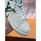 L Charlie Low Top Leather Trainers In White And Green - Toe Close-Up Close-up view of the perforated toe box and lace eyelets on L white and green trainers