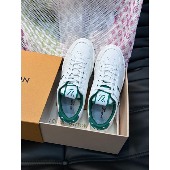 L Charlie Low Top Leather Trainers In White And Green - In Box L white and green leather trainers positioned inside an open branded presentation box