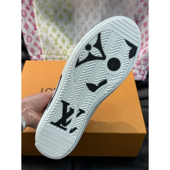 L Charlie White Trainer Sole Tread View Underside view of white L Charlie trainer outsole featuring black monogram tread patterns