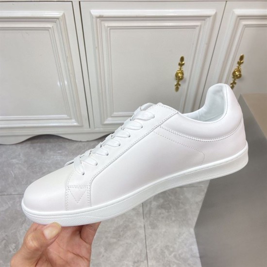 L classic white leather trainers with gold motif accent inner side view L classic white leather trainers with gold motif accent shown from the clean inner side