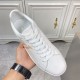 L classic white leather trainers with gold motif accent top down view L classic white leather trainers with gold motif accent overhead look at laces and tongue