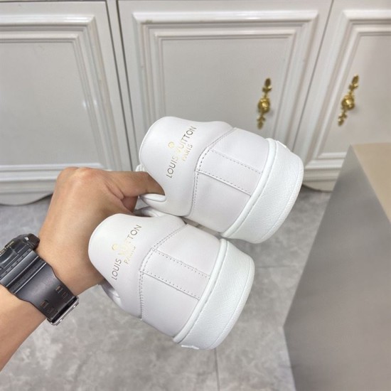 L classic white leather trainers with gold motif accent heel detail L classic white leather trainers with gold motif accent heel counters showing gold text