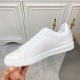 L Classic Leather Trainers Clean Side View in white and blue Side profile of L white leather trainers highlighting smooth finish in white and blue