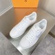 L Classic Leather Trainers Top Angle in white and blue Top-down view of L white leather trainers showing laces and toe box in white and blue