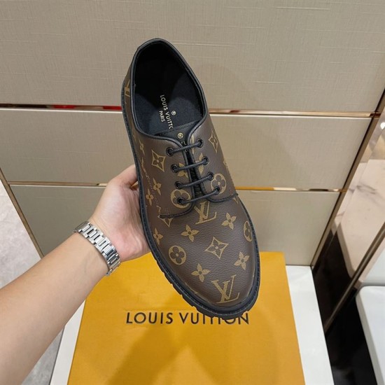 L Monogram Canvas Derby Shoes In Brown Handheld Top Angle in brown and black Close-up holding view of the brown monogram canvas upper and black laces