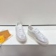 L White Trainers Angled Side View in white and beige Angled view of L white trainers highlighting side panels and platform soles in white and beige