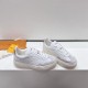 L White Platform Trainers Pair Upper View in white and beige Pair of L white platform trainers showing upper and side angles in white and beige
