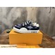 L Ollie Richelieu Navy Blue Low Top Trainers - Angled View L Ollie Richelieu navy blue low top trainer angled view from the side