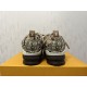 L Skate Sneaker heel view in brown snakeskin pattern Rear view of the L Skate Sneaker in brown snakeskin pattern